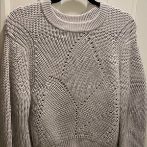 Grey knit crew neck sweater with detailing